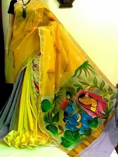 Mural design with hand paintings on yellow saree.